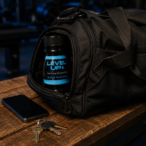 LEVEL UP bottle tucked in the side pocket of a gym bag on a wooden bench